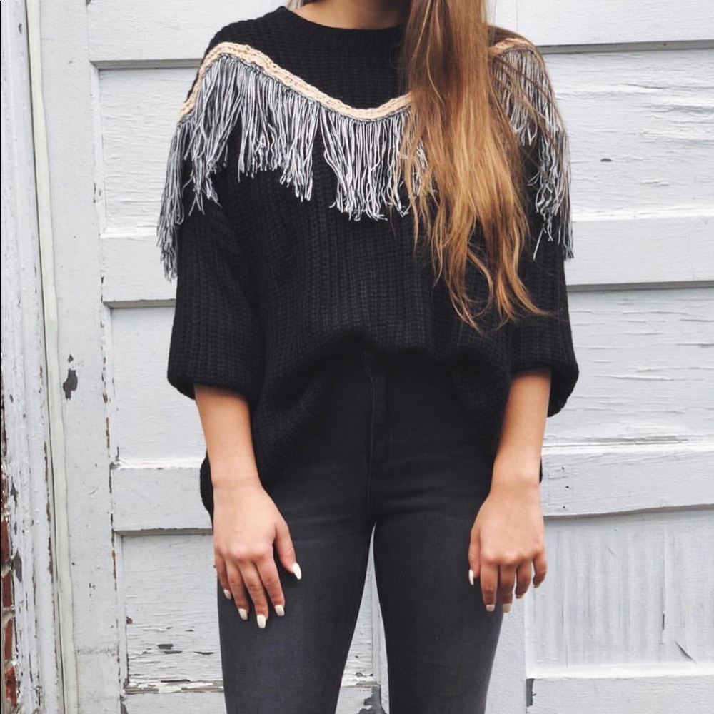 Black sweater with fringe design